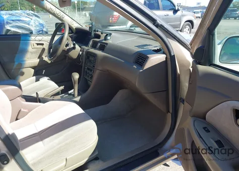 1999 Toyota Camry Le z USA, uszkodzony, nr VIN 4T1BG22K5XU394768